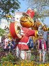Parade at the Magical Kingdom - scarecrow and yellow fall flowers.