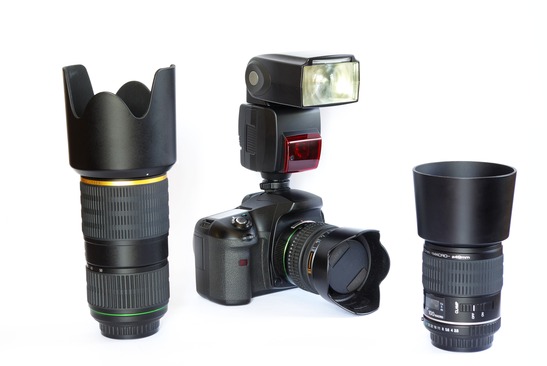 SLR camera body, lenses and flash unit.